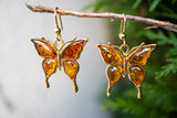 Boucles d'oreilles avec ambres cognac en forme de papillon