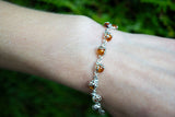 Bracelet avec ambre cognac en forme de coccinelle