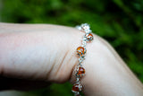 Bracelet avec ambre cognac en forme de coccinelle