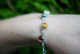 Bracelet avec ambre multicouleurs en forme de coccinelle