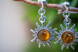 Boucles d'oreilles en ambre cognac en forme de soleil