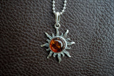 925 silver sun pendant with cognac amber from the Baltic Sea