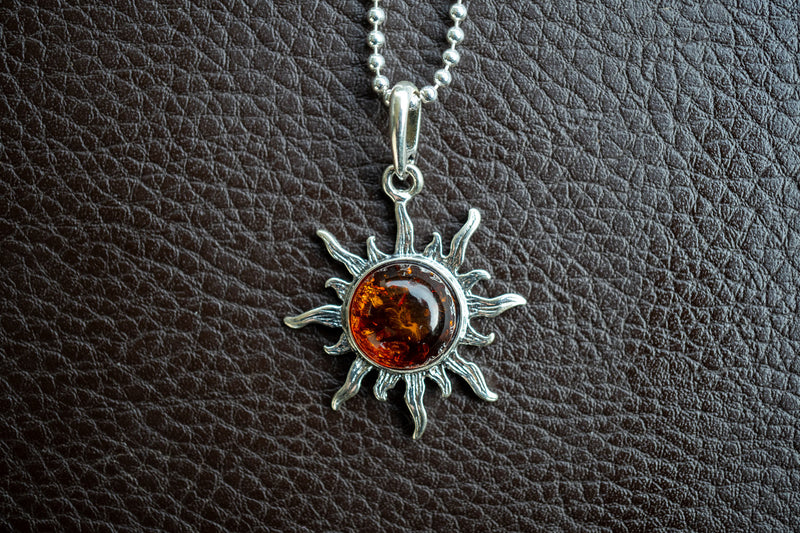 925 silver sun pendant with cognac amber from the Baltic Sea