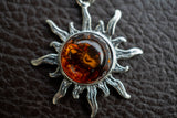 925 silver sun pendant with cognac amber from the Baltic Sea