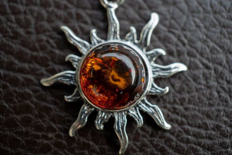 925 silver sun pendant with cognac amber from the Baltic Sea