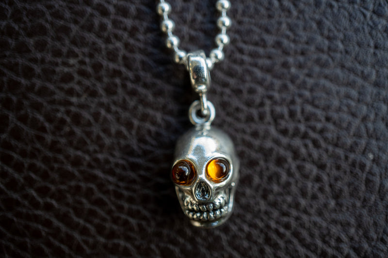 925 silver skull pendant with cognac amber from the Baltic Sea