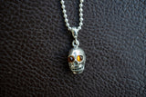 925 silver skull pendant with cognac amber from the Baltic Sea