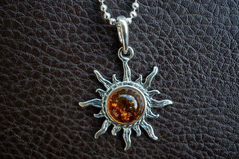 925 silver sun pendant with cognac amber from the Baltic Sea