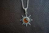 925 silver sun pendant with cognac amber from the Baltic Sea