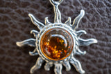 925 silver sun pendant with cognac amber from the Baltic Sea