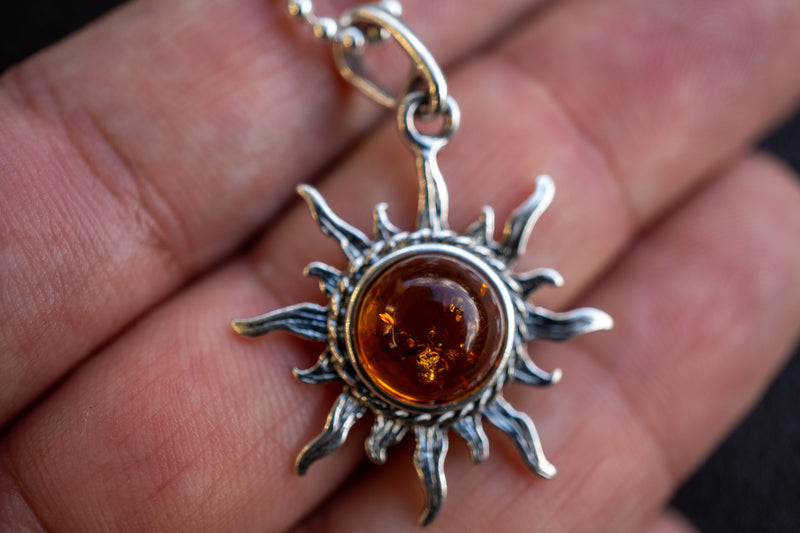 925 silver sun pendant with cognac amber from the Baltic Sea