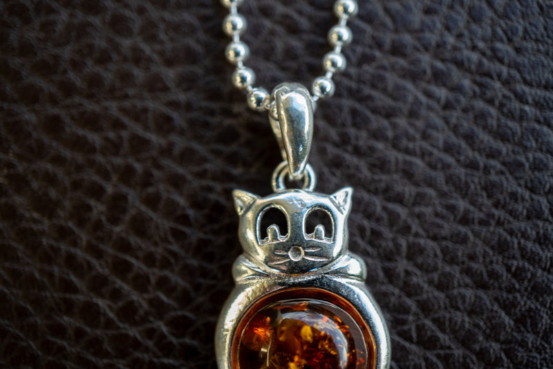 925 silver cat pendant with cognac amber from the Baltic Sea