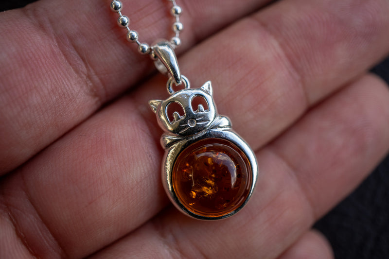 925 silver cat pendant with cognac amber from the Baltic Sea