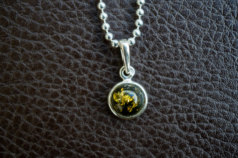 925 silver pendant with green amber from the Baltic Sea