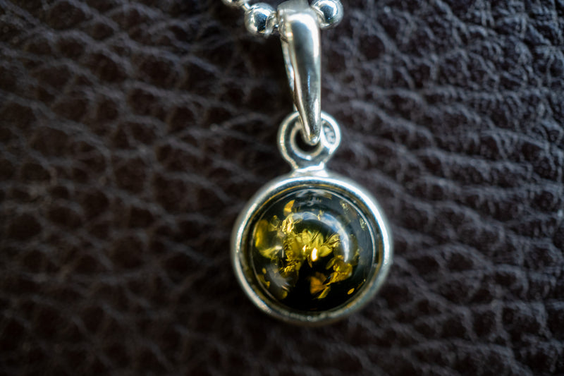 925 silver pendant with green amber from the Baltic Sea