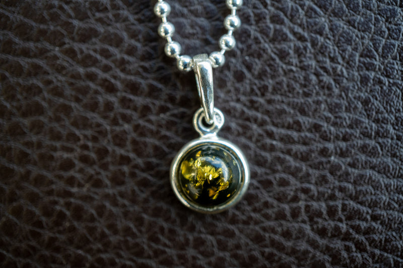 925 silver pendant with green amber from the Baltic Sea