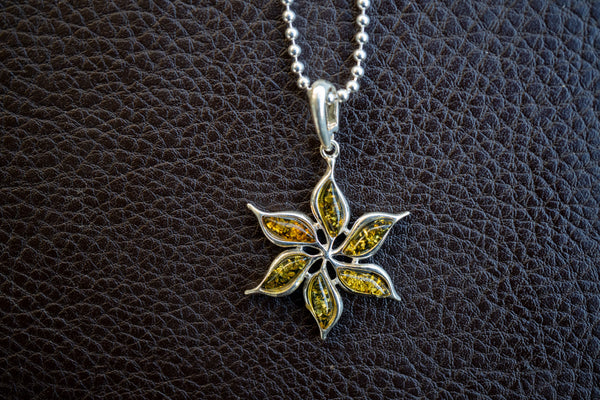 Pendant with amber in the shape of the sun