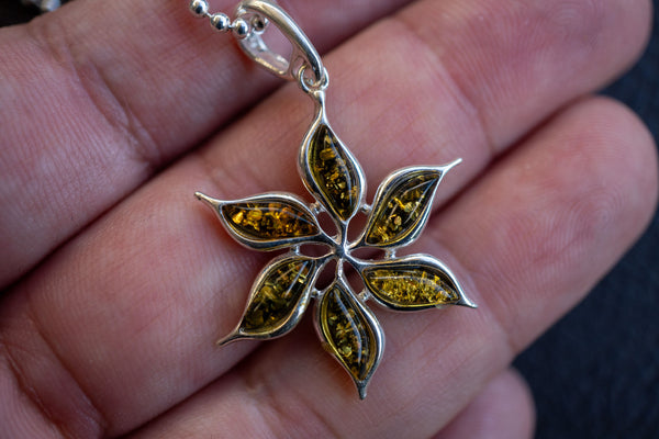 Pendant with amber in the shape of the sun