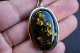 Oval Pendant in 925 Silver with Green Baltic Amber